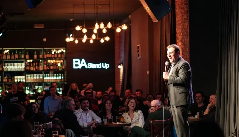 Stand-up comedian performing live inside a comedy club in Buenos Aires, Argentina.