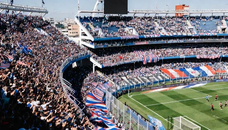 Passionate fans and international students at a football match in Buenos Aires, Argentina.