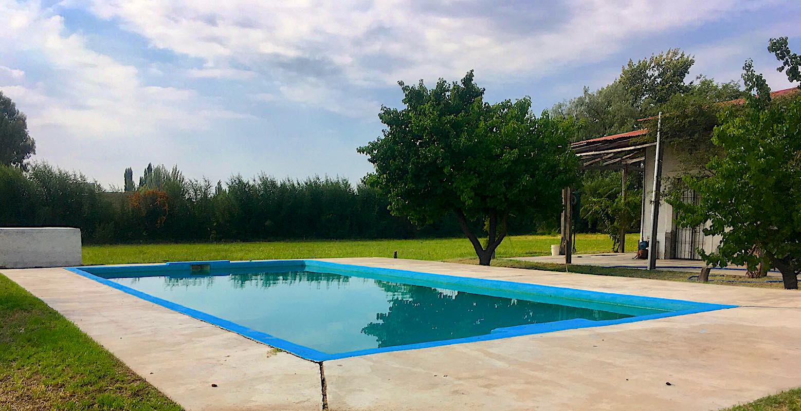 PRICE INCLUDES ALL CLOSING COSTS! 25 Acre Farm with Home & Pool, 8.5 Acres of Malbec Vineyard, Tourist Area Very Near Airport
